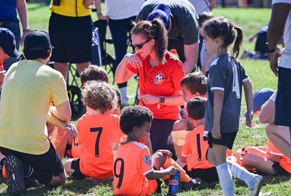 Coach working with players at Region 13